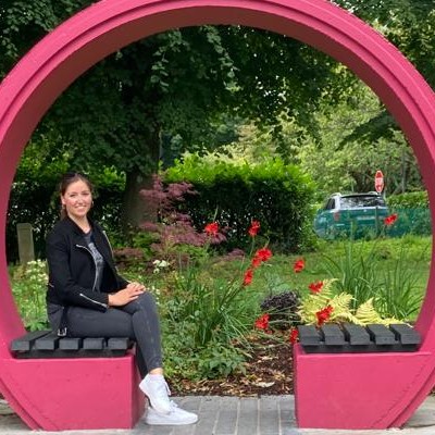 Photo of Anja, author of this testimonial, sitting in the Croi garden on campus