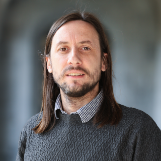 Dr Colm Ó Cuaig, BA, MA, PhD (NUI)