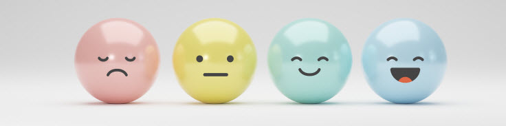 Balls with happy and sad faces to describe feedback