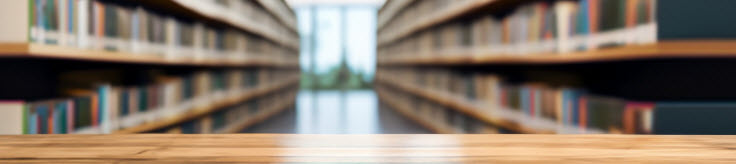 a desk with rows of books behind