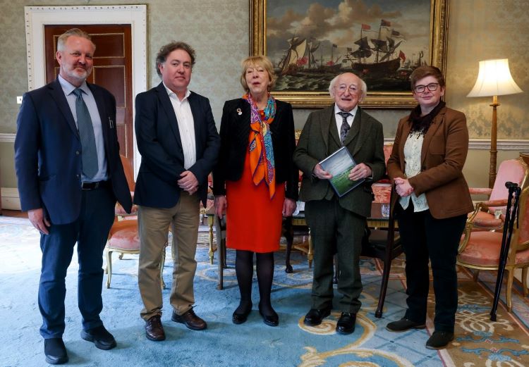 President Micheal D. Higgins and wife Sabina with archaeologists Dr Michelle Comber (left) and Joe Fenwick and Dr Noel McCarthy (right)