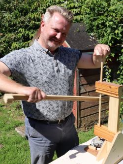 Using a bow-drill to grind an aperture in a flint nodule. Experimental Archaeology.