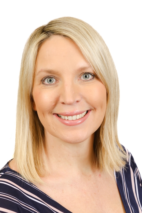Aisling Lennon smiles against a white background