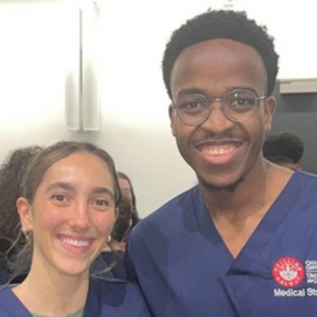Both winning students pictured together in a close up head shot, both in their scrubs unifroms
