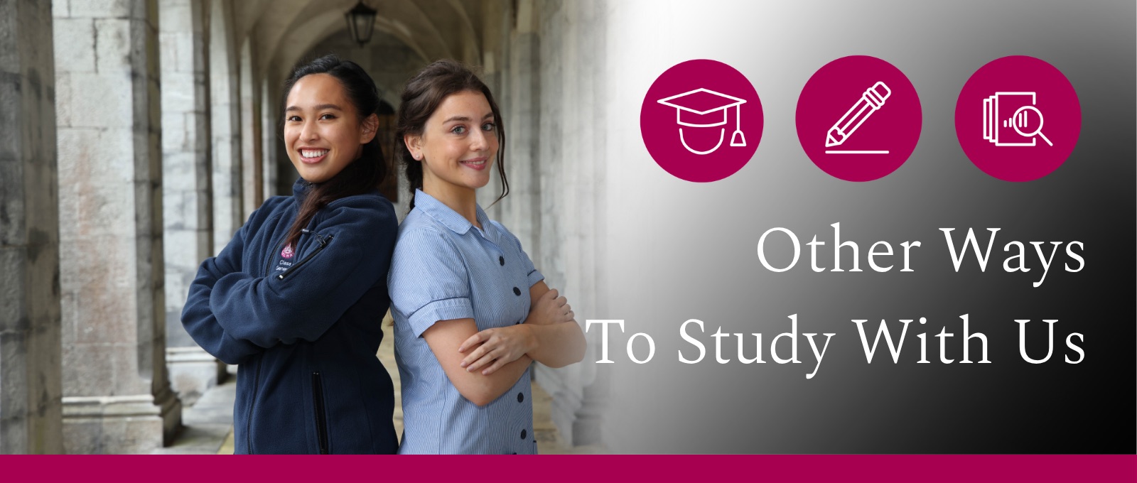 2 students inside the quadrangle, with their back against each other smiling to the camera