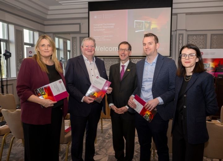 A picture of four people at an event