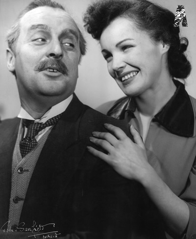 1957 Geoffrey Golden & Maire Ni Dhomhnaill in Boyd's Shop, St. John Gree