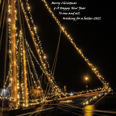 Galway Hooker, Naomh Cronan, all lit up for Christmas in the Claddagh basin. 