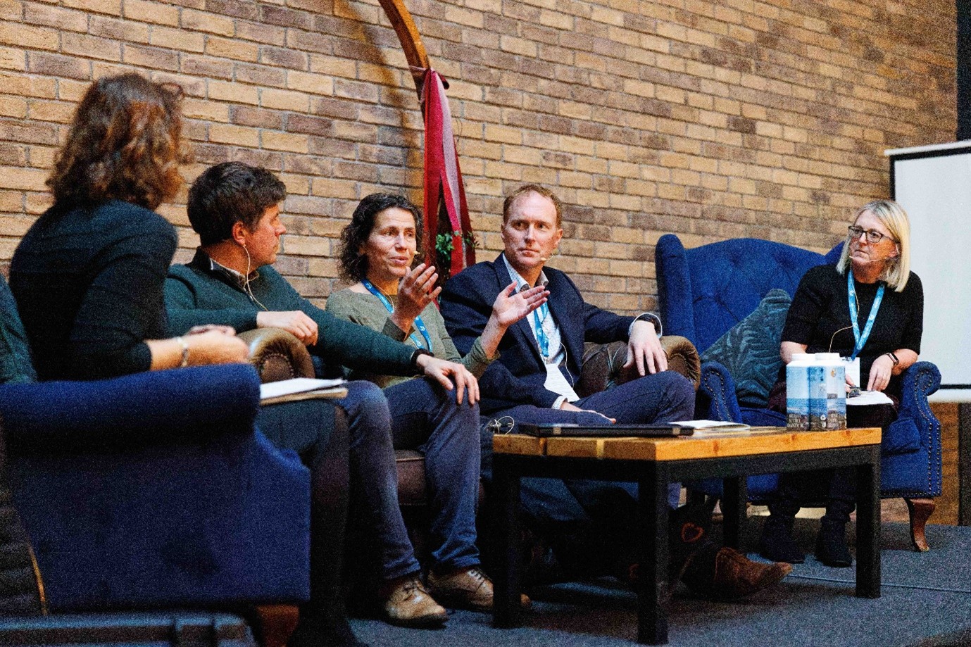 Panel discussion participants (on couch) Matthew Hornsby, Department of Climate, Energy & the Environment, Dr. Catherine Farrell from Trinity College Dublin and Prof Stephen Hynes, SEMRU with panel chairs Dr Clare Glanville, Geological Survey Ireland and Carol Gleeson, Clare County Council