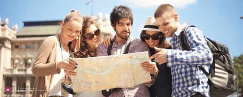 men and women looking at a map