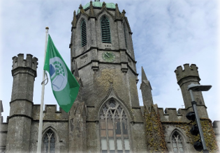 green flag flying outside the Quadrangle